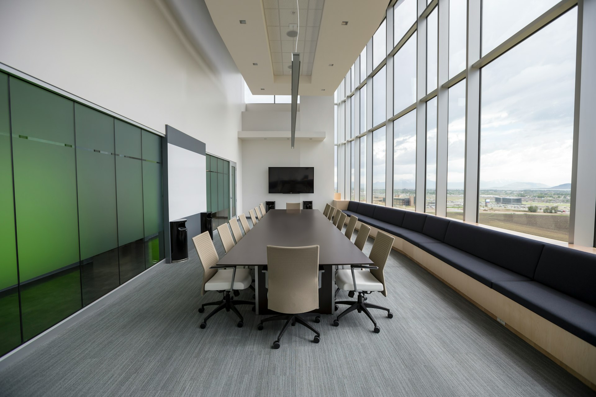 rectangular brown wooden table with chair lot inside building